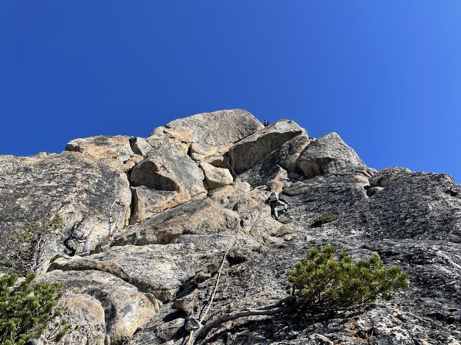 Weathered granite boulders against a deep blue sky